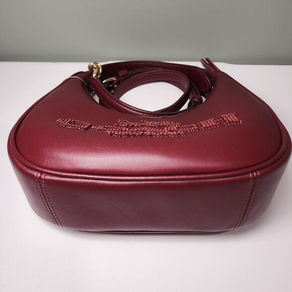 NWT Coach CCE60 Carmen Mini Crossbody Beaded Coach Graphic In DARK WINE Leather - Picture 2 of 7